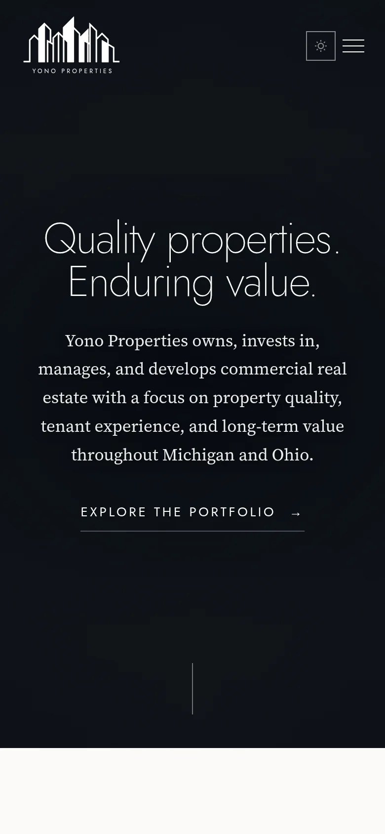 Yono Properties homepage on mobile, with skyline logo, company introduction and Explore the Portfolio link.